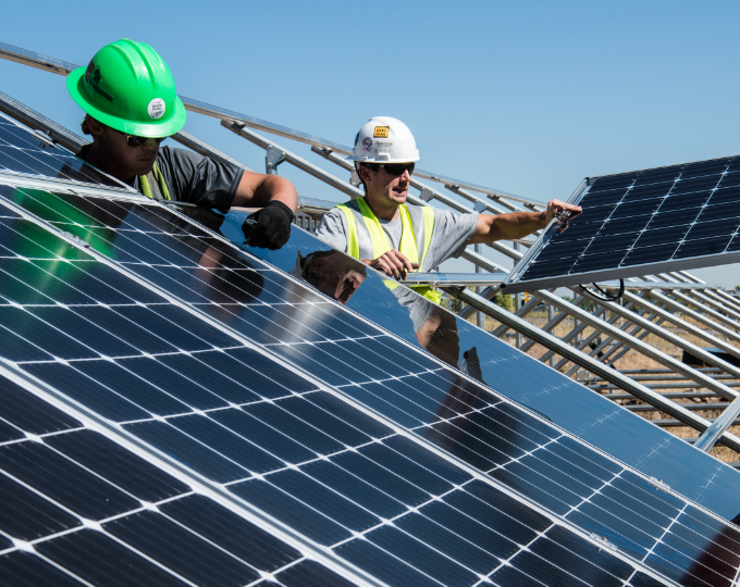 Solar technicians installing panels